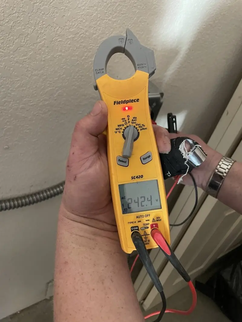 Voltage testing with clamp meter during Ceiling Fan Installation in Indian Head Park